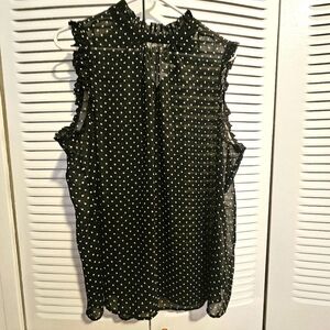 Sleeveless sheer top with ruffle accents